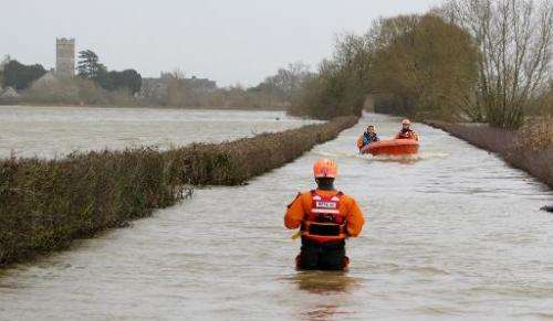 Rescuers carry out operations following flooding in Muchelney, Somerset on January 6, 2014