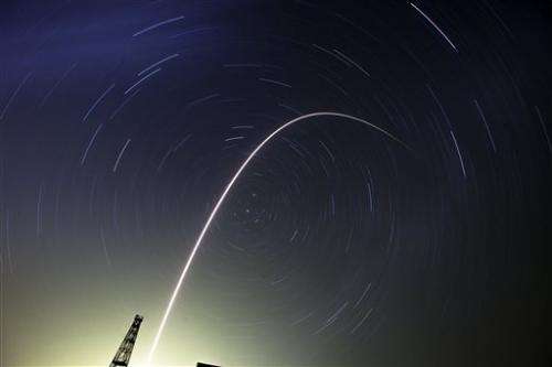 Rocket with three-man crew lifts off for space station