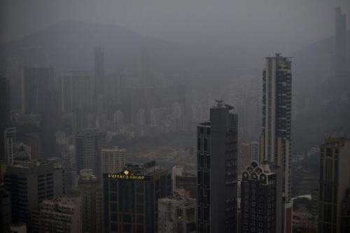 Smog haze hangs over the downtown business districts of Hong Kong on December 10, 2013
