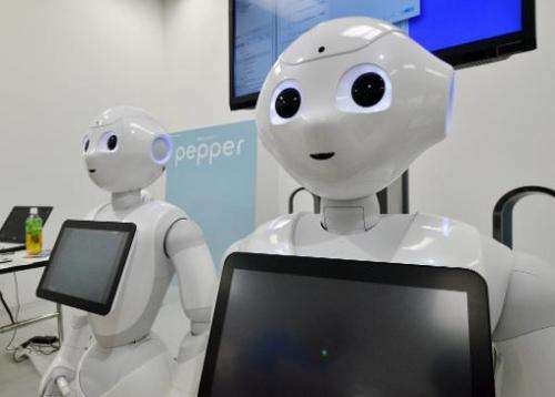 Softbank's humanoid robot &quot;Pepper&quot; is displayed at a high-tech gadgets exhibition in Tokyo