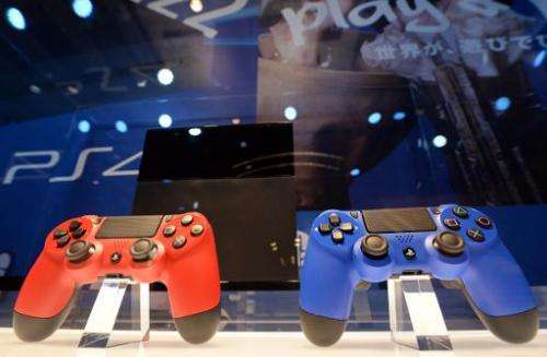 Sony's PlayStation 4 game consoles are displayed in Tokyo on February 1, 2014