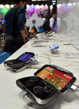 South Korean electronics giant Samsung Galaxy smartphone, with video game controler, is displayed at the annual Tokyo Game Show 