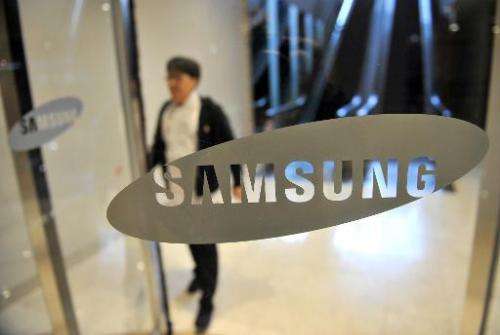 South Korea's Samsung posted an 18 percent drop in operating profit in the fourth quarter as slowing sales of high-end smartphon