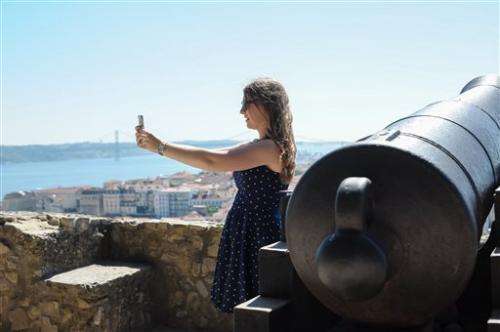 Teens love vacation selfies; adults, not so much