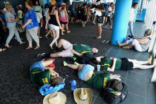 Tennis fans rest indoors after play was suspended due to 'extreme' heat on day four of the Australian Open tournament, in Melbou