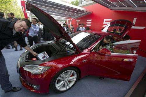 Tesla delivers first China cars, plans expansion
