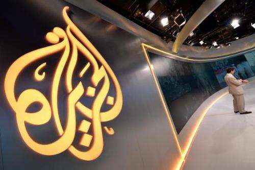 The Al Jazeera logo seen at their television broadcast studio in New York, August 16, 2013