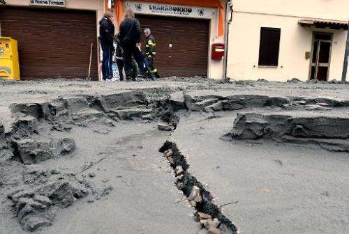The central street of San Carlo village is damaged following a powerful earthquake that shook Italy's industrial and densely pop