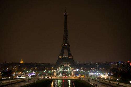 The Eiffel tower is plunged into darkness during Earth Hour on March 23, 2013 in Paris
