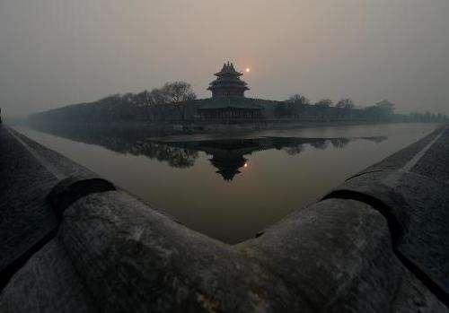 The Forbidden City is shrouded in heavy air pollution in Beijing on December 7, 2013