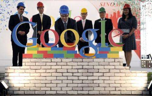 The Google letters are completed on stage at a press conference in Singapore on December 15, 2011