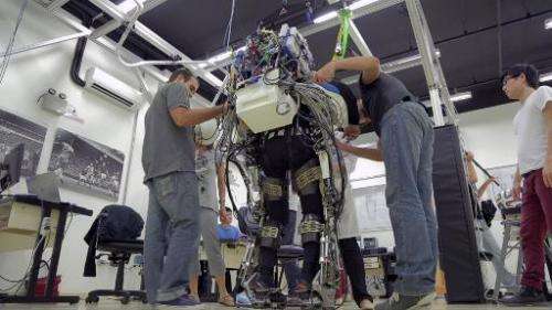 The Iron Man-like suit a paraplegic will wear to kick first ball of the World Cup, created by Brazilian scientist Miguel Nicolel