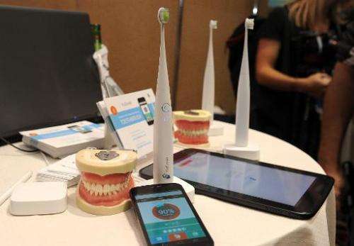 The Kolibree toothbrush, the world's first Internet-connected toothbrush, is displayed at the &quot;CES: Unveiled,&quot; media p