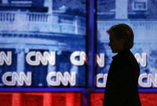 Then-senator Hillary Clinton is silhouetted off stage during a debate on January 31, 2008