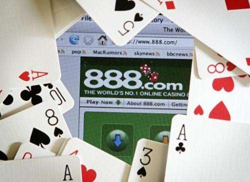 The online gambling website of 888 holdings is pictured surrounded by a deck of cards in London on November 6, 2006