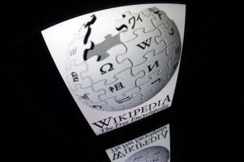 The &quot;Wikipedia&quot; logo is seen on a tablet screen on December 4, 2012 in Paris