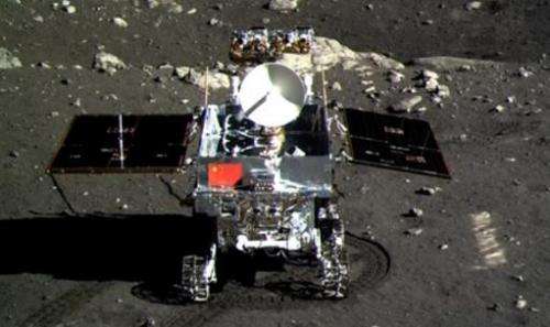 This screen grab, taken from a CCTV footage, shows a photo of the Jade Rabbit moon rover, taken by the Chang'e-3 probe lander on