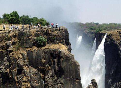 Tourists view the Victoria Falls in Livingstone, Zambia, on November 11, 2004