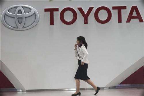 Toyota raises forecast on profit jump, weak yen