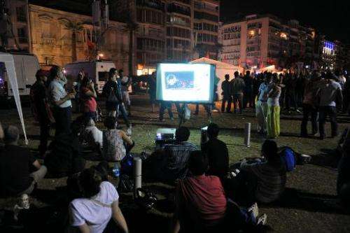 Turkish protesters watch videos from YouTube at Gundogdu Square in Izmir, on June 8, 2013