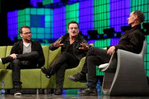 U2 frontman Bono (C) speaks on centre stage during the last day of the Web Summit in Dublin, Ireland, on November 6, 2014