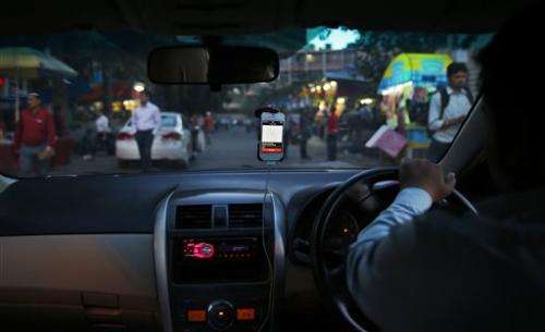 Uber meets local lookalikes in Asia taxi-app wars