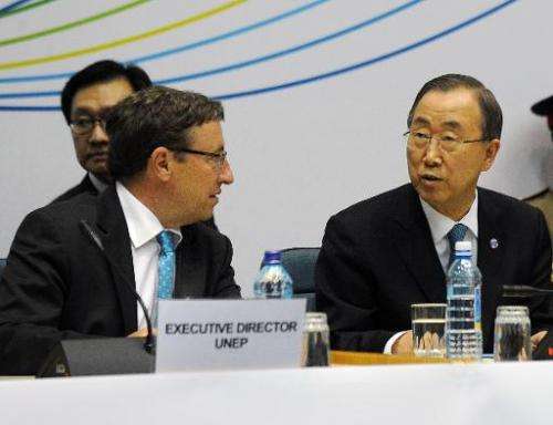 UN environment programme head Achim Steiner (L) and UN Secretary General Ban Ki-moon attend the closing ceremony of the UN Envir