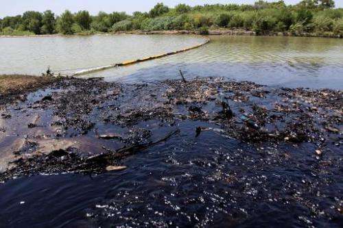View of the San Juan river after an oil spill, in San Juan Cadereyta, Mexico, on August 21, 2014