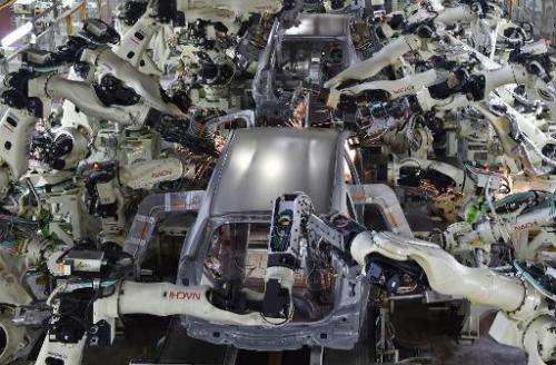 View shows the body welding workshop which uses automated welding machine robots at Toyota Motor's Tsutsumi plant in Japan on De