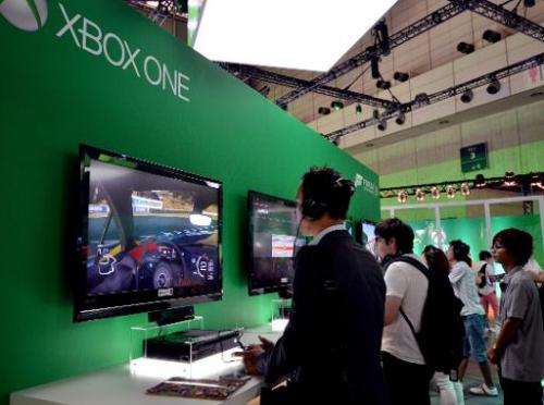 Visitors play US software giant Microsoft's Xbox One at the Tokyo Game Show in Chiba, suburban Tokyo on September 19, 2013