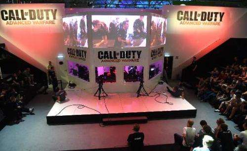 Visitors to the &quot;Gamescom&quot; fair play &quot;Call of Duty: Advanced Warfare&quot; on August 14, 2014 in Cologne, Germany