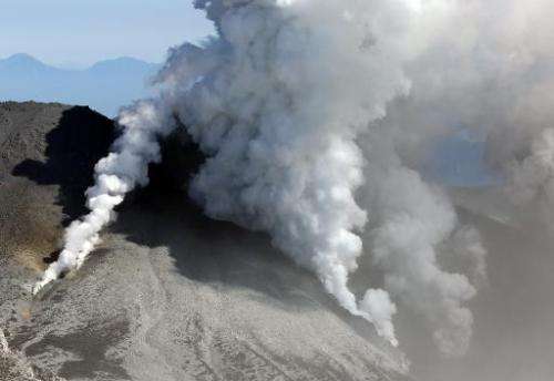 White smokes rises from Mount Ontake on September 28, 2014, one day after it erupted in central Japan