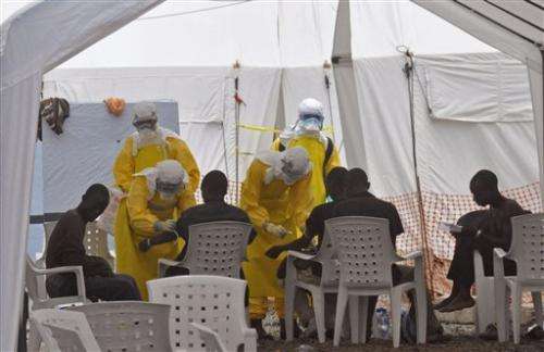 WHO adjusts conditions as staffers get Ebola