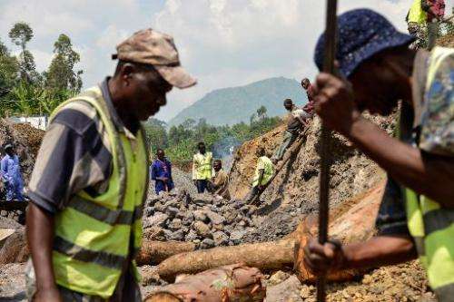 Workers in the Virunga National Park dig and scour the bed of a future canal in Matebe, some 75 kms north of Goma, eastern Democ