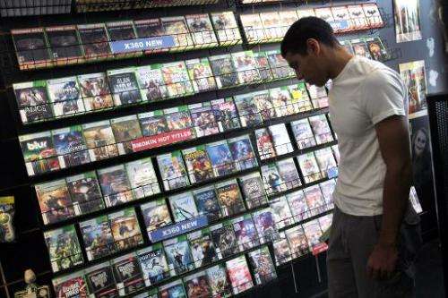 Xabriel Carpio shops for a video game on June 27, 2011 in Miami, Florida