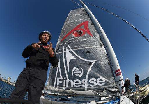 Alain Thébault of France stands next to the &quot;Hydroptère&quot; prior to attempting a record crossing from Los Angeles to Haw