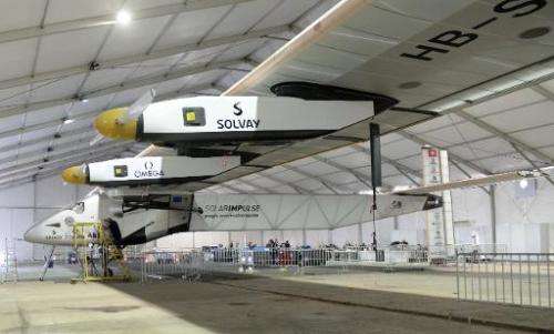 A support team member works on Solar Impulse 2, the world's only solar powered aircraft, at Sardar Vallabhbhai Patel Internation