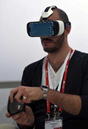 A visitor tests a Samsung Gear VR at the 2015 Mobile World Congress in Barcelona