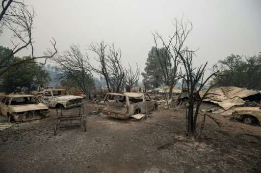 Burned vehicles sit at a property charred by the Valley fire  in Middletown, California on September 13, 2015