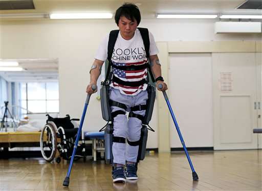 Exoskeleton that helps paralyzed walk faces barrier in Japan