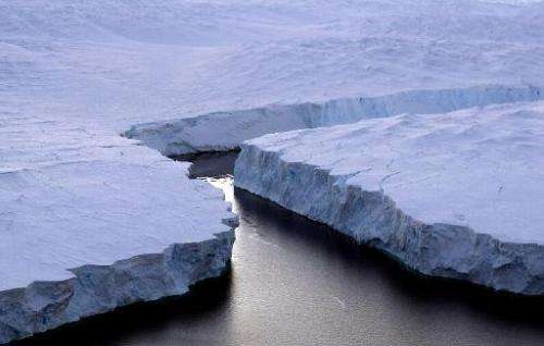 File photo of an iceberg (R) breaking off the Knox Coast in the Australian Antarctic Territory, as seen on January 11, 2008