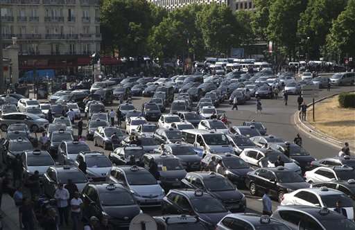 French taxis strike after weeks of rising tension over Uber