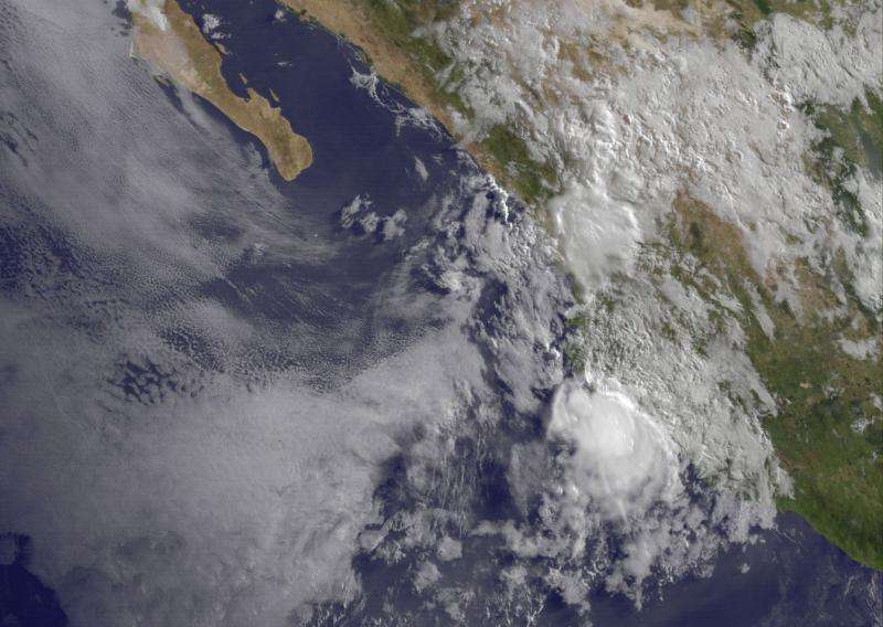 NASA shows a weaker compact tropical storm Carlos