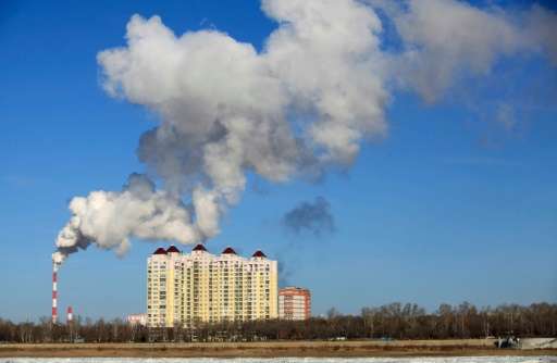 Smoke belches from a heating factory chimney in Heihe, in northeastern China's Heilongjiang province