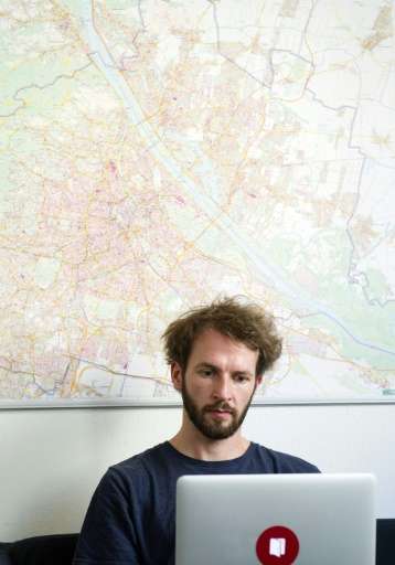 Stefan Theissbacher, founder and developer of the social media platform 'Frag Nebenan' ('Ask Next Door') is pictured in his offi