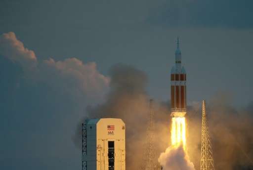 The United Launch Alliance Delta 4 rocket carrying NASA's first Orion deep space exploration craft takes off from the launch pad