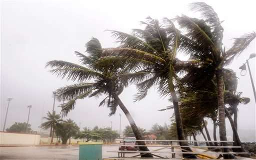 Typhoon pelts Guam with winds, rain; residents take shelter