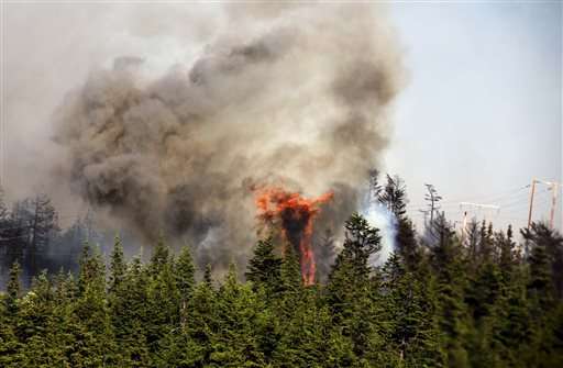 Western wildfires: Firefighters battle blazes in 4 states