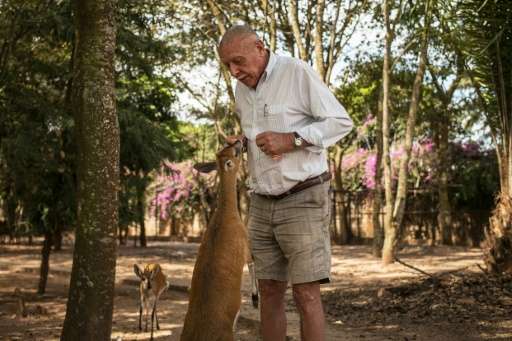 Willem Boulanger feeds an antelope in his small zoo in the back yard of his house in Kolwezi, in Democratic Republic of Congo's 