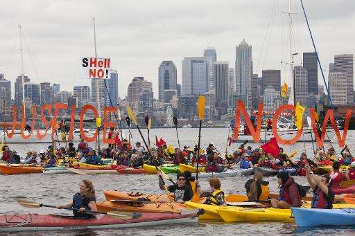 Environmental activists in Seattle paddle out to sea to protest a Shell oil rig moored off the coast of the US city that is head